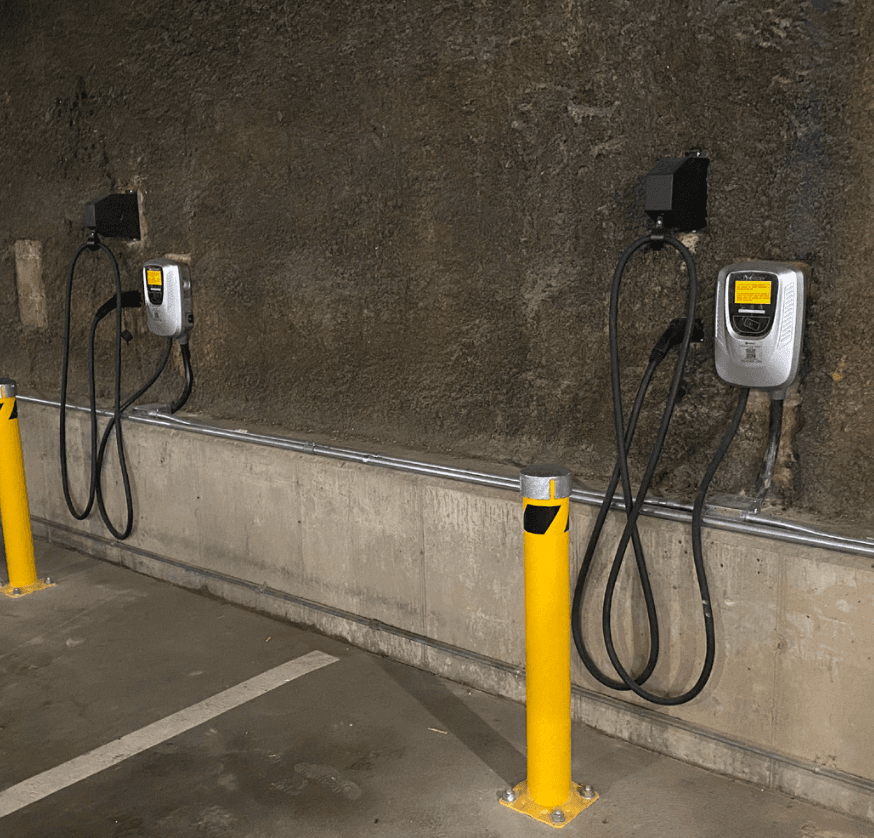 wall mounted ev chargers in a parking garage